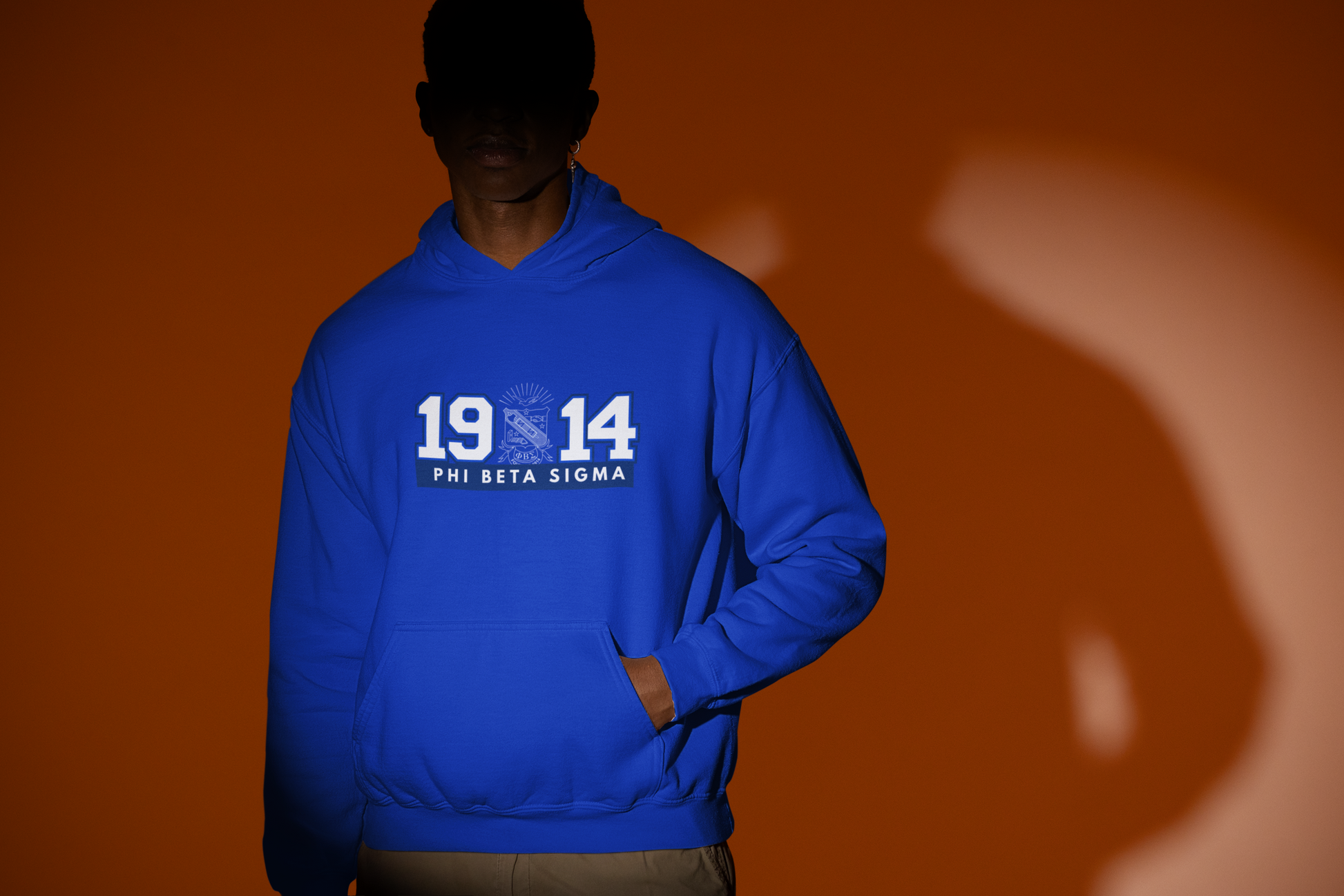 Royal blue Phi Beta Sigma 1914 hoodie featuring the fraternity shield crest and kangaroo pocket on a pullover sweatshirt.