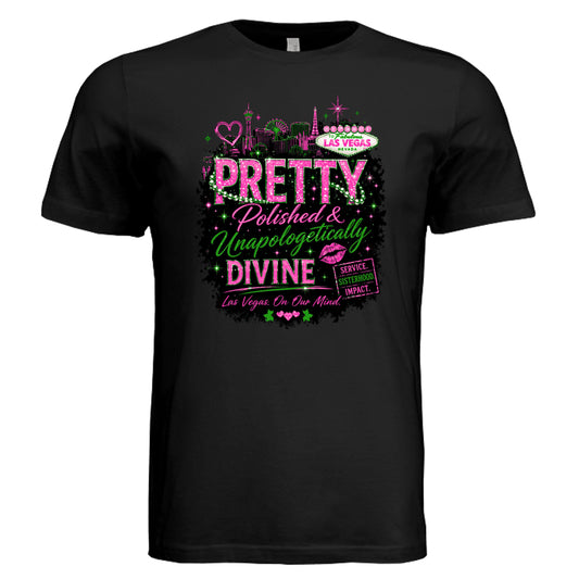 Black graphic t-shirt featuring “Pretty, Polished & Unapologetically Divine” design with bold pink and green lettering, Las Vegas skyline accents, and empowering message—perfect for women’s conferences, travel, and statement fashion